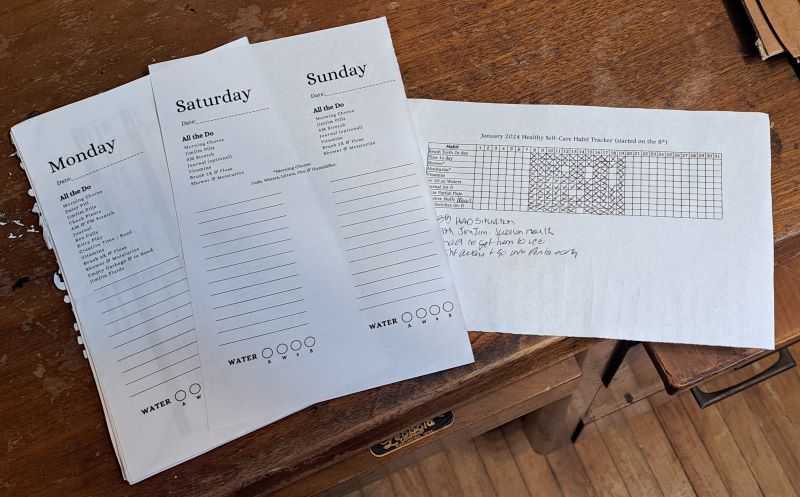 printed to-do lists and goal tracking sheet